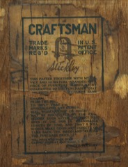 Gustav Stickley signature paper label and guarantee on back of cabinet.